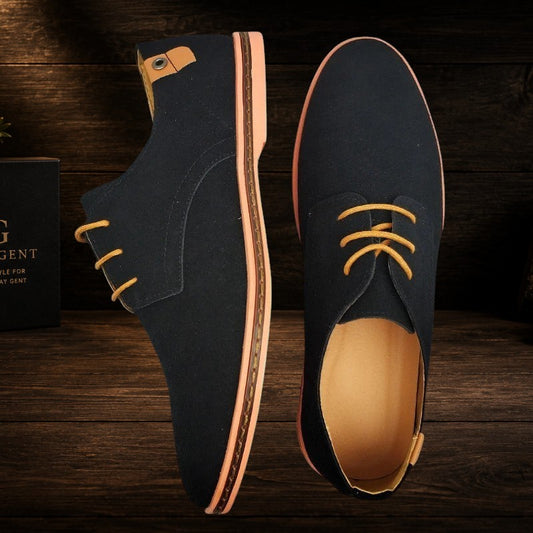 Daily Gent Kensington Suede Oxford dress shoes in navy blue with orange laces and a light peach sole.