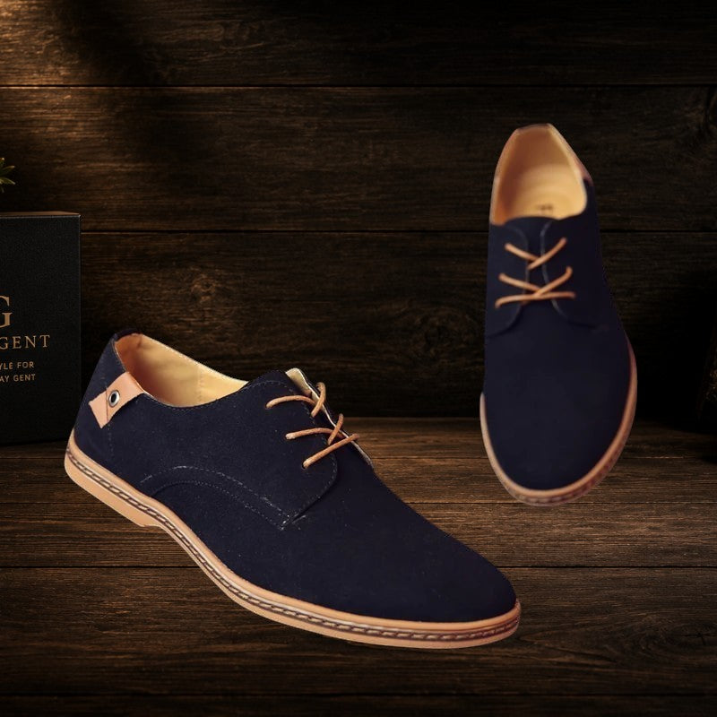 Daily Gent navy blue suede leather Oxford dress shoes with tan laces and tan sole detail. Classic lace-up design.